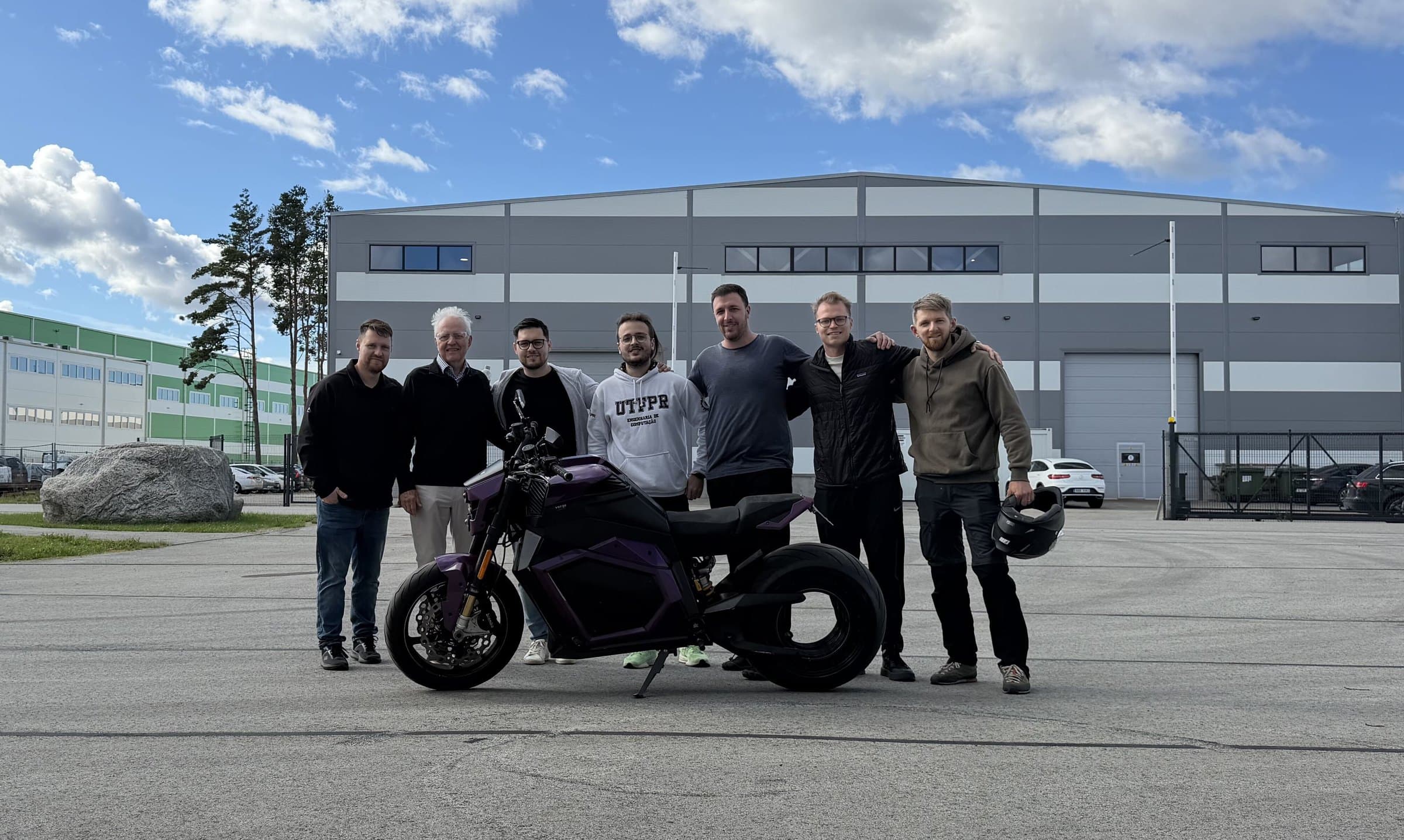 The team outside the building